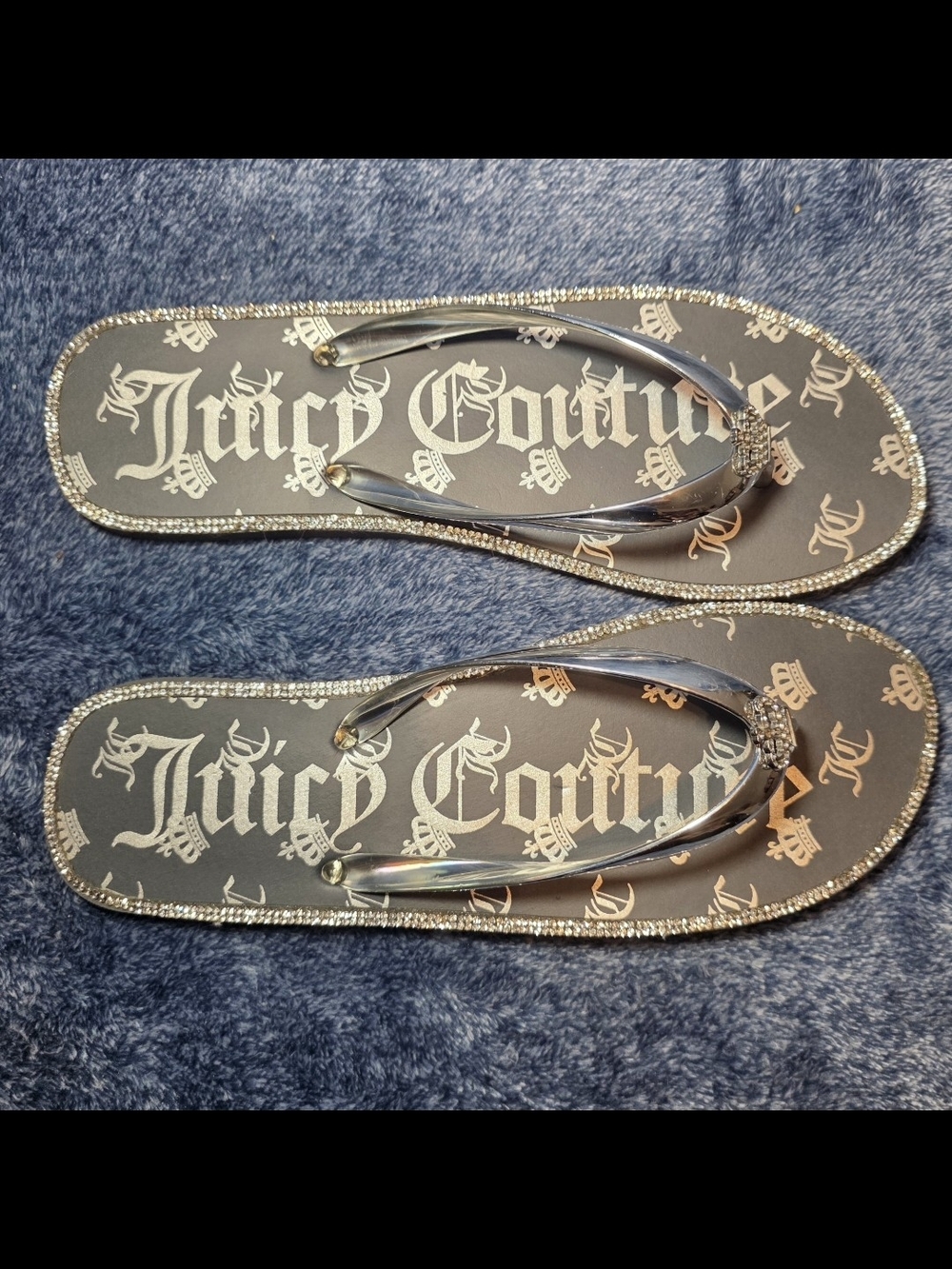 Juicy Couture Pink Label Sticker on Blue Textured Surface